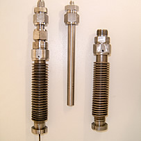 PvT Sample Cells - Complete, loaded cell (Left) and separated cell showing sample containment tube (right) 